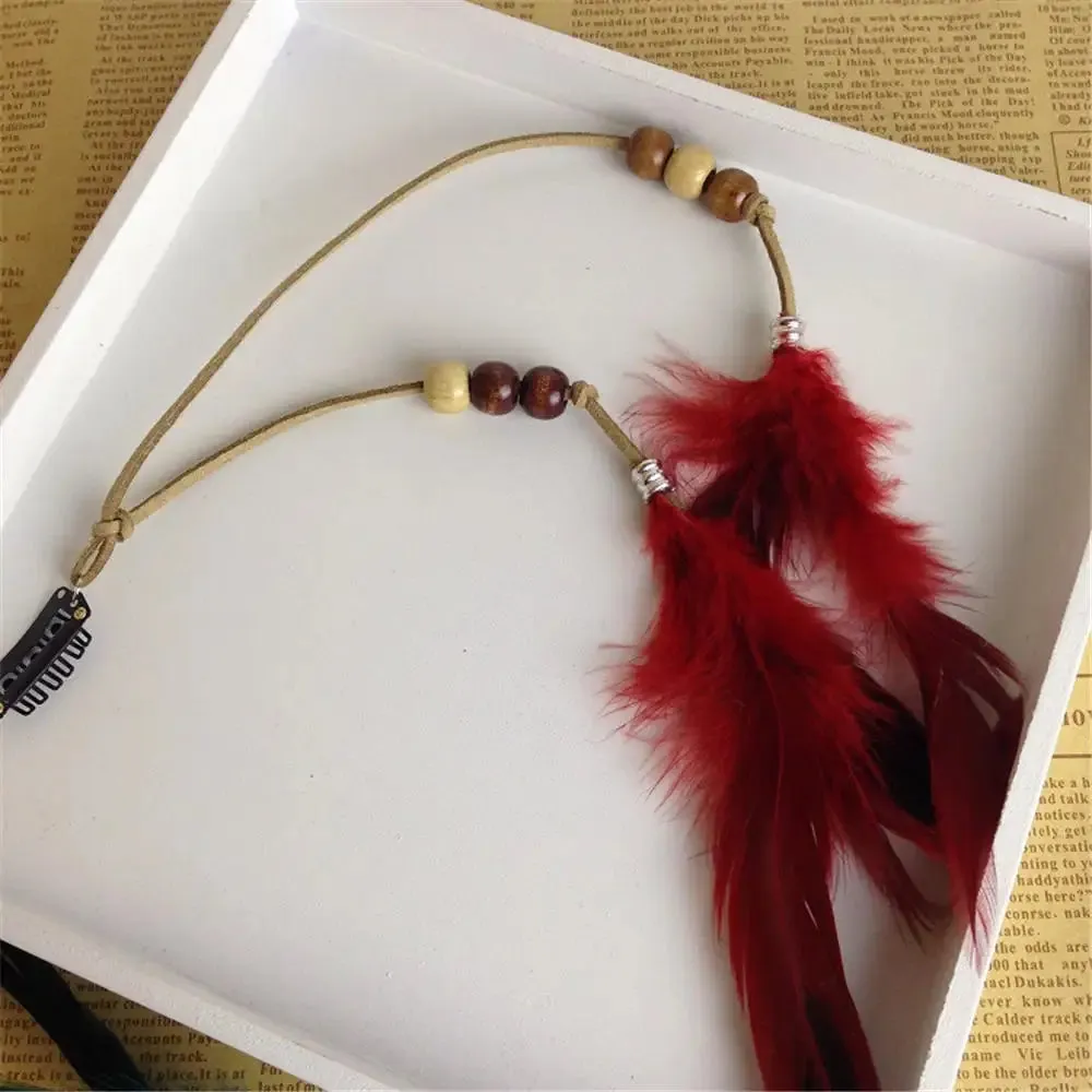 Boho Elegance Unleashed: Embrace Festival Vibes with our Bohemian Feather Hairband